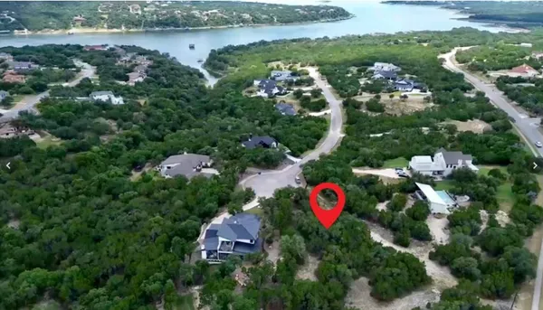 an aerial view of residential house with outdoor space and swimming pool