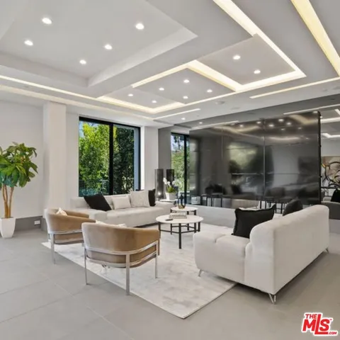 a living room with couches and a fireplace