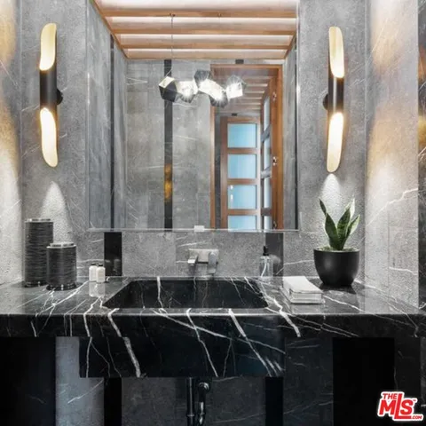 a spacious bedroom with a bed and a large window