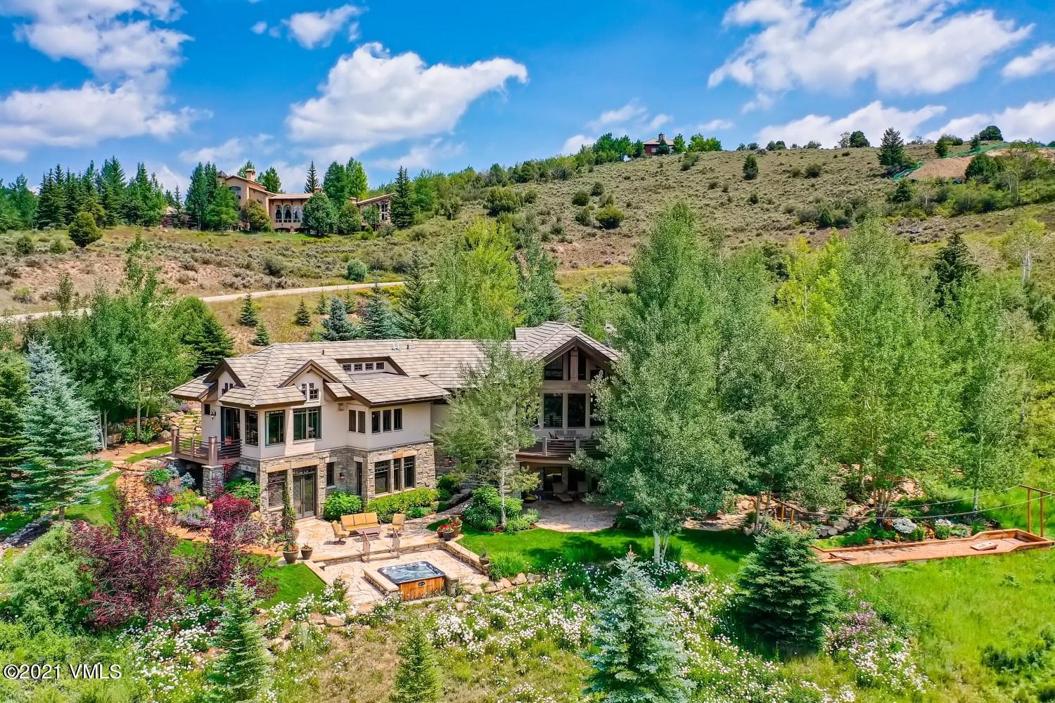 an aerial view of a house with a big yard