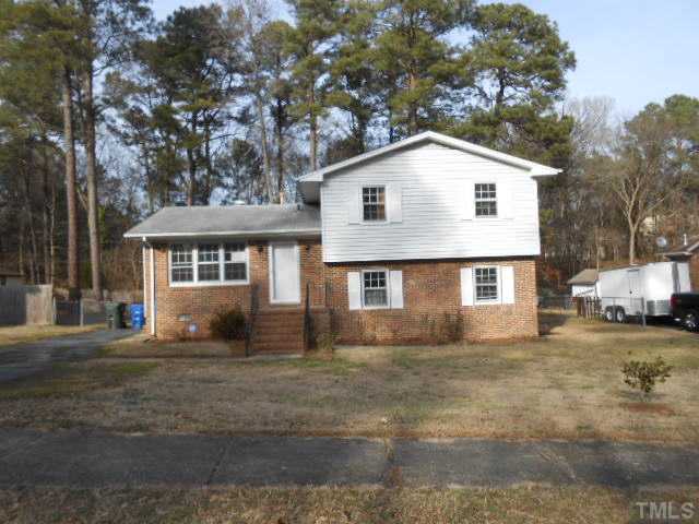 4700 Waterbury Road Raleigh, NC 27604 - Photo 1 of 9 a view of a white house next to a yard with large trees
