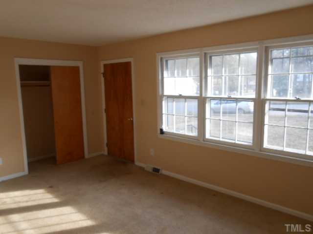 4700 Waterbury Road Raleigh, NC 27604 - Photo 4 of 9 a view of an empty room with a window