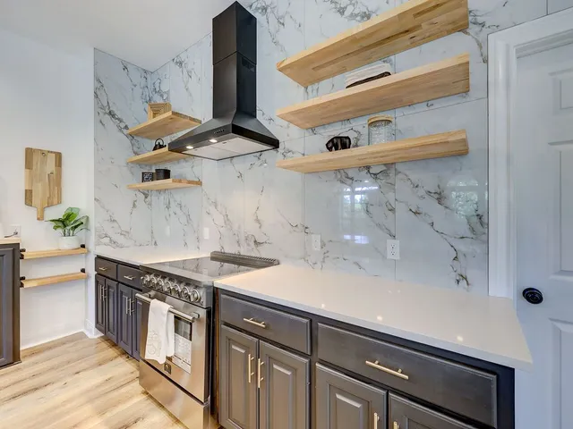 a kitchen with a sink and a stove