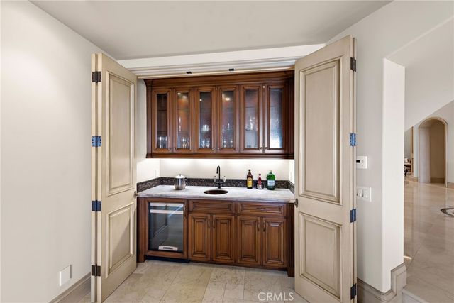 a view of a patio with couches table and chairs and potted plants