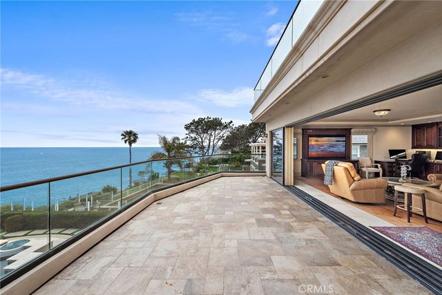 a view of a terrace with furniture and a table