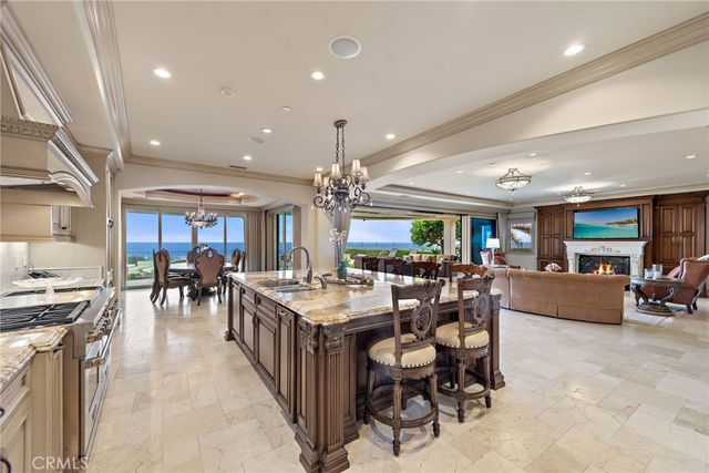 a large kitchen with lots of counter space dining table and chairs