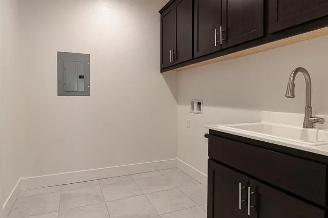 a view of a kitchen with a sink stainless steel appliances and cabinets