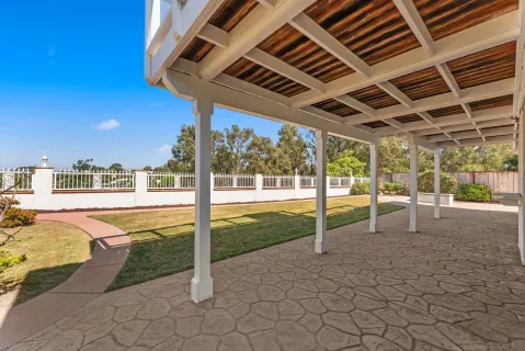 a view of a swimming pool with a porch