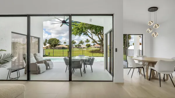 a view of a dining room with furniture window and outside view