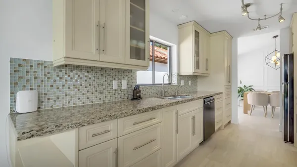 a kitchen with a sink and cabinets