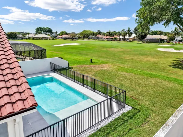 a view of a patio with chairs