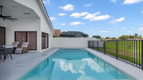 a view of a backyard with sitting area