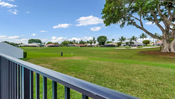 a view of a garden and trees