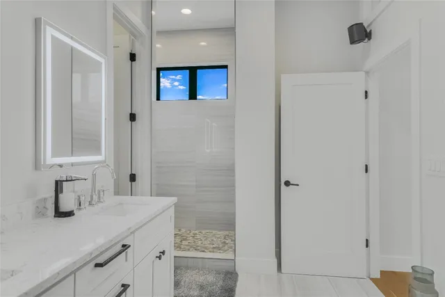 a bathroom with a sink and a mirror