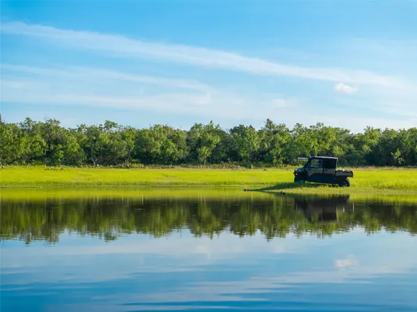 a view of a lake with a big yard