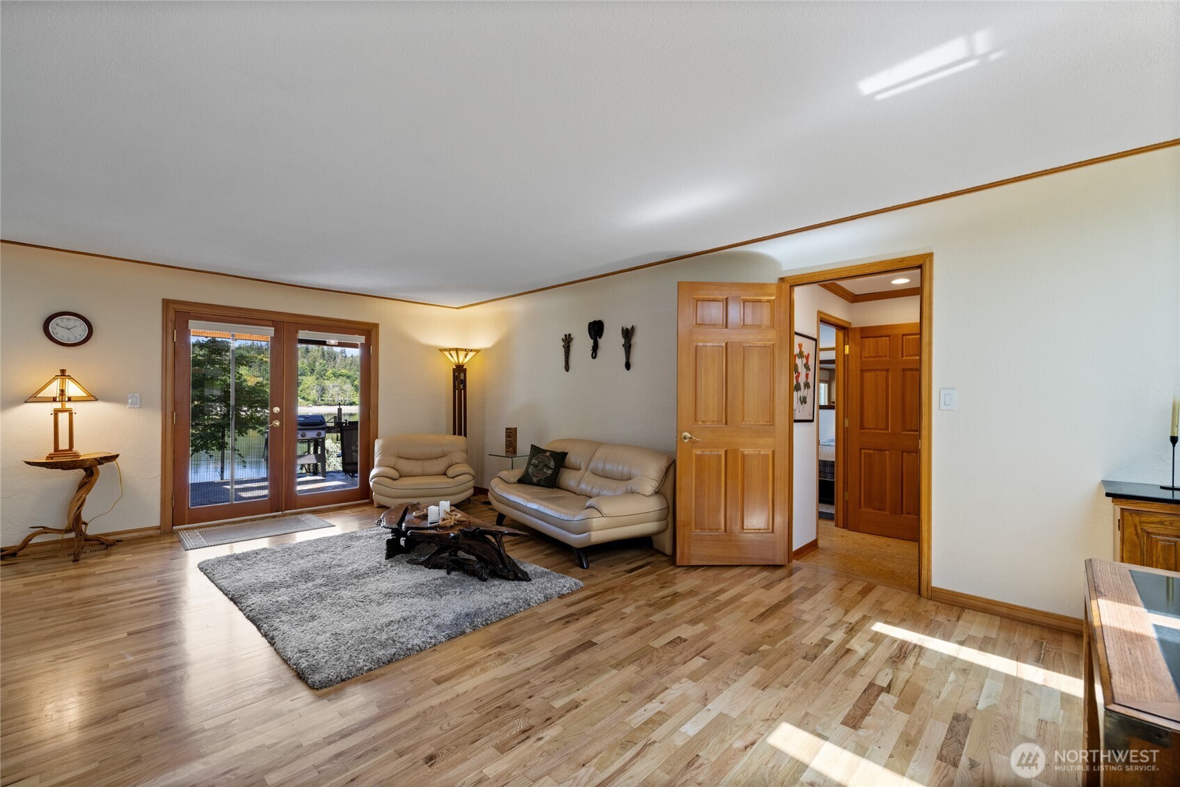 295 Southeast Bayview Road Shelton, WA 98584 - Photo 12 of 40 a living room with furniture and wooden floor