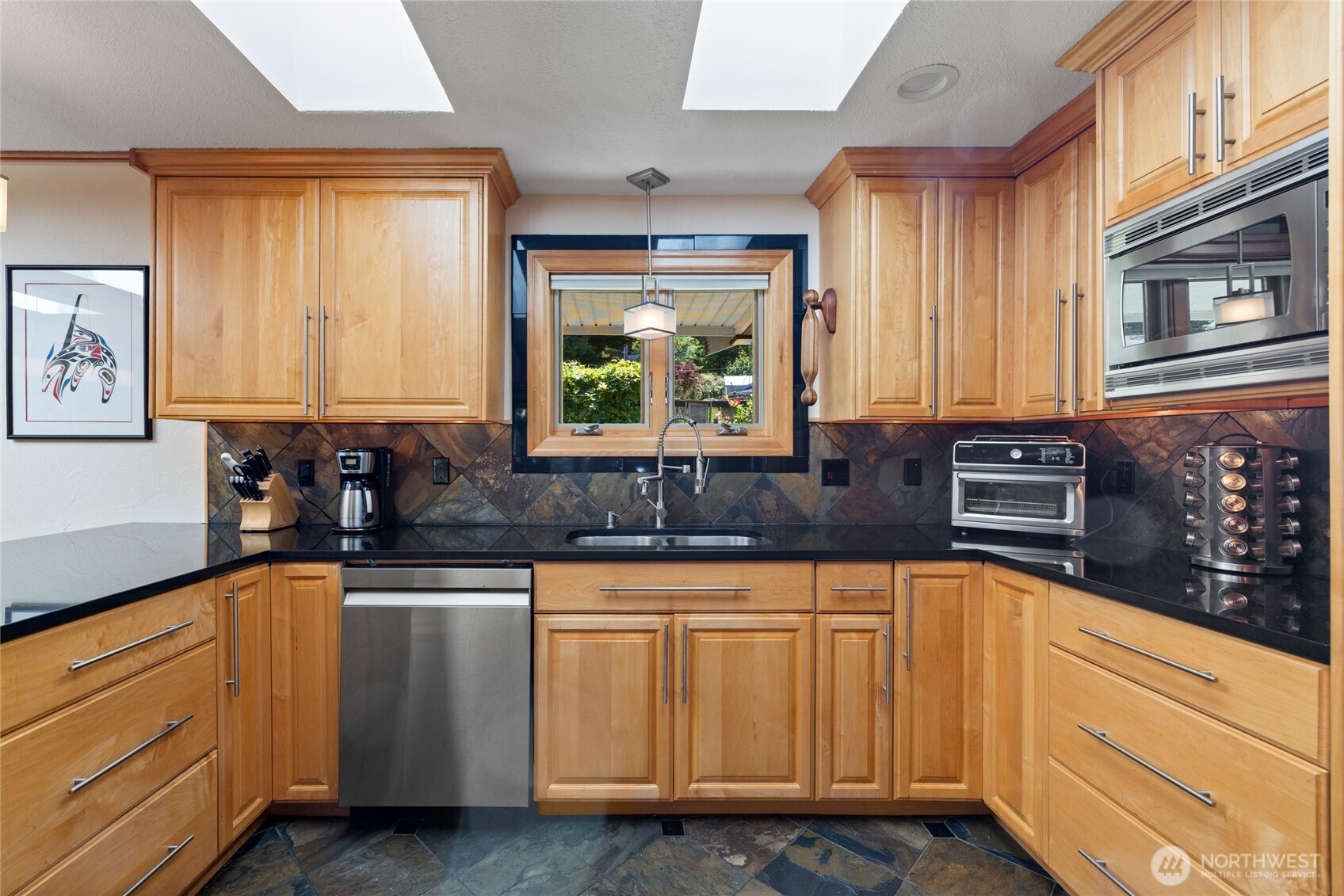 295 Southeast Bayview Road Shelton, WA 98584 - Photo 14 of 40 a kitchen with granite countertop white cabinets and white appliances