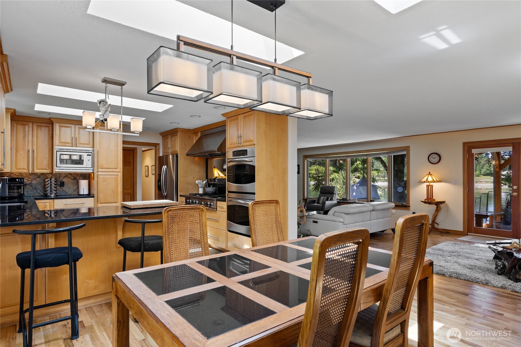 295 Southeast Bayview Road Shelton, WA 98584 - Photo 18 of 40 a view of a dining room with furniture window and wooden floor