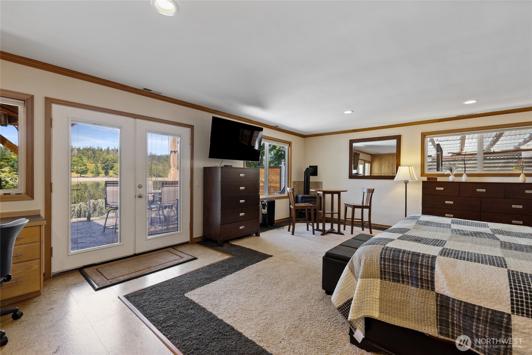 295 Southeast Bayview Road Shelton, WA 98584 - Photo 19 of 40 a bedroom with a bed a bookshelf a desk and chair