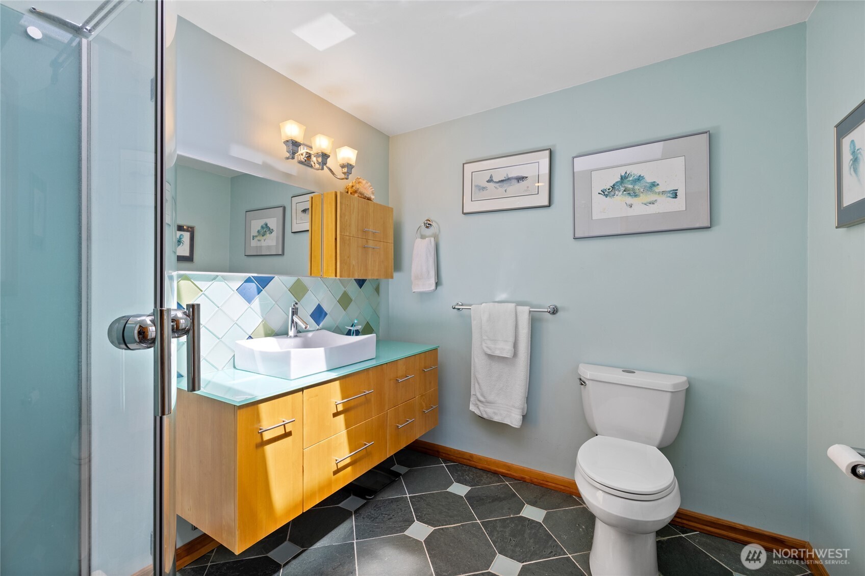 295 Southeast Bayview Road Shelton, WA 98584 - Photo 24 of 40 a bathroom with a toilet sink and mirror