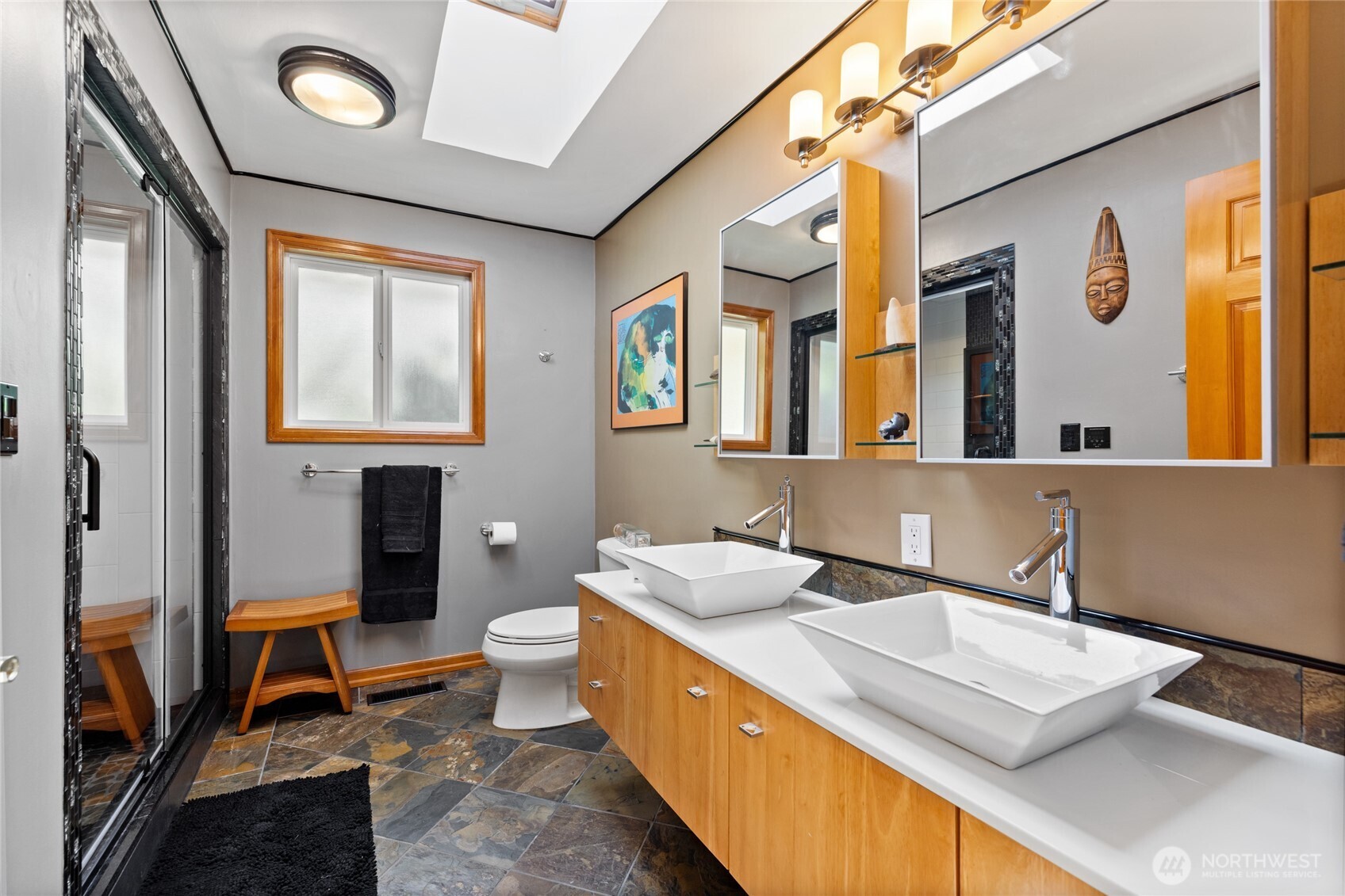 295 Southeast Bayview Road Shelton, WA 98584 - Photo 27 of 40 a bathroom with a sink a toilet and mirror