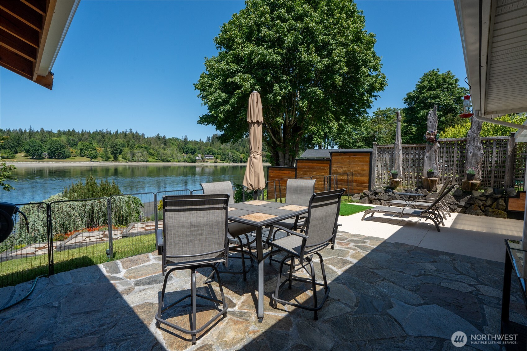 295 Southeast Bayview Road Shelton, WA 98584 - Photo 31 of 40 an outdoor sitting area with furniture and wooden floor