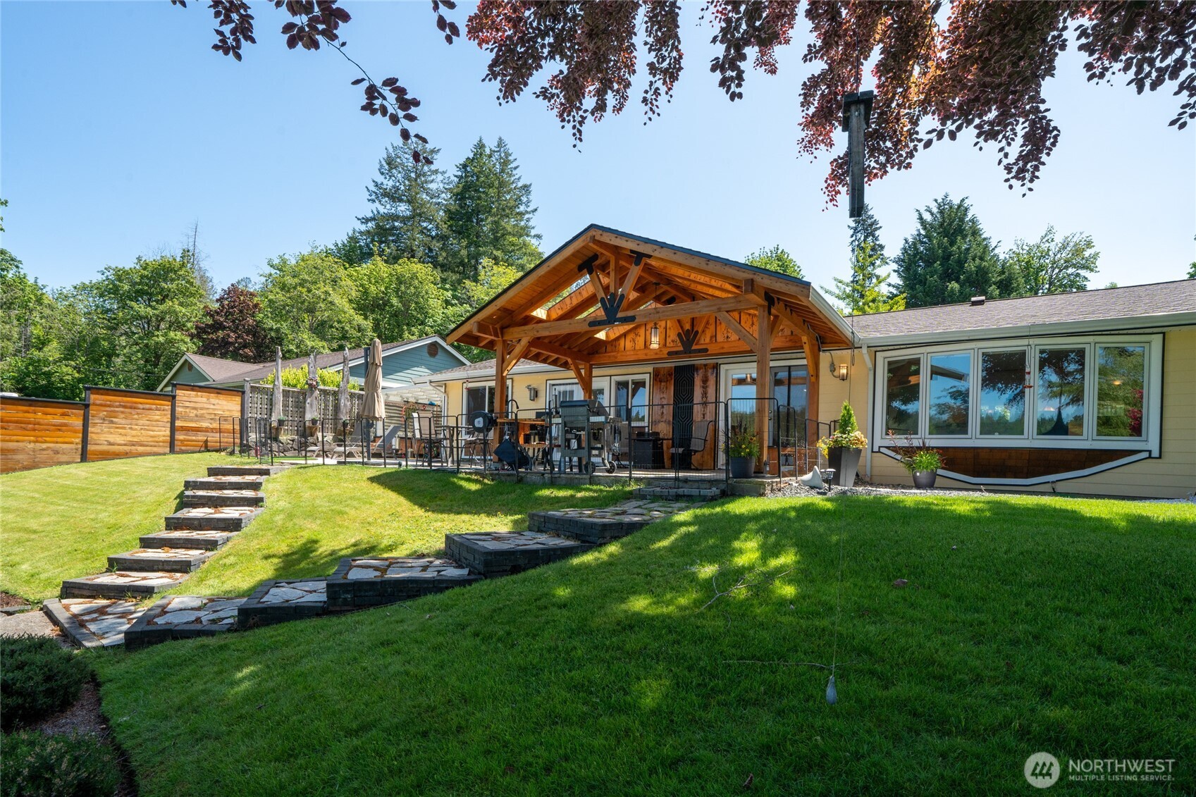 295 Southeast Bayview Road Shelton, WA 98584 - Photo 34 of 40 a view of house with garden and swimming pool