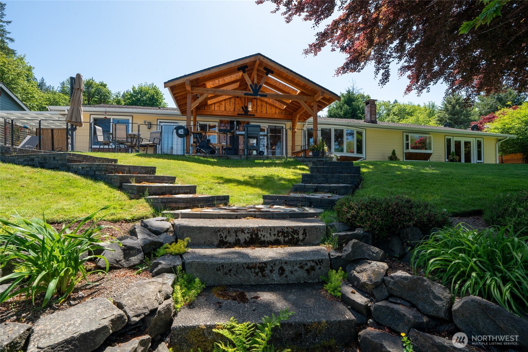 295 Southeast Bayview Road Shelton, WA 98584 - Photo 35 of 40 a front view of a house with garden