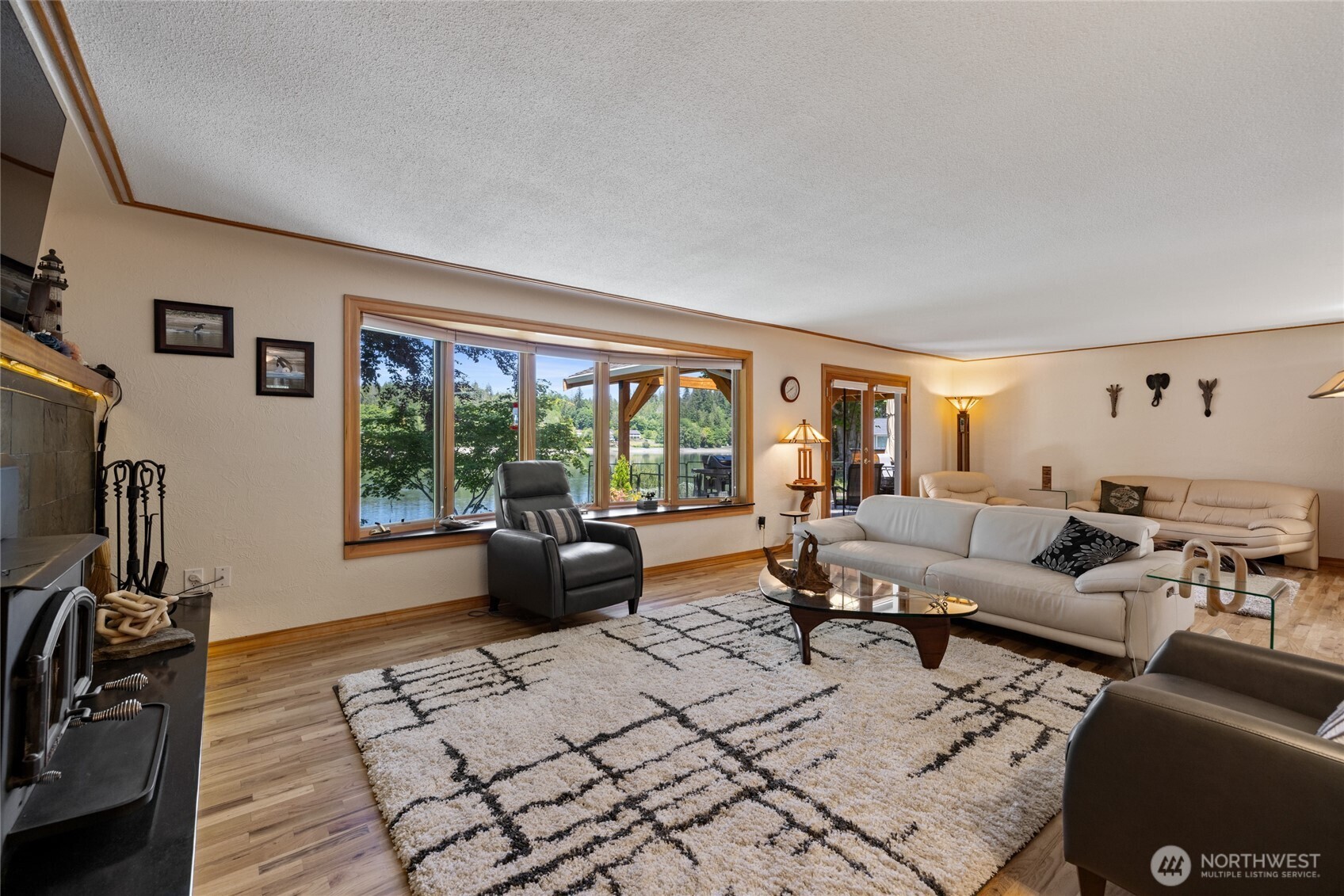 295 Southeast Bayview Road Shelton, WA 98584 - Photo 5 of 40 a living room with furniture and a flat screen tv
