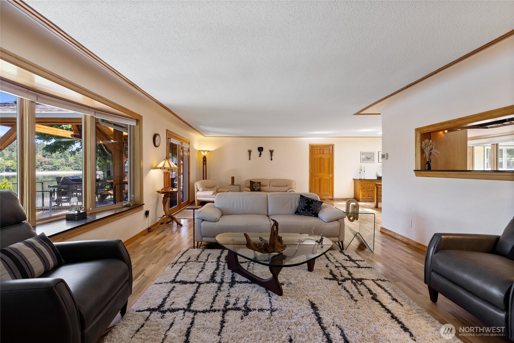 295 Southeast Bayview Road Shelton, WA 98584 - Photo 6 of 40 a living room with furniture and a large window