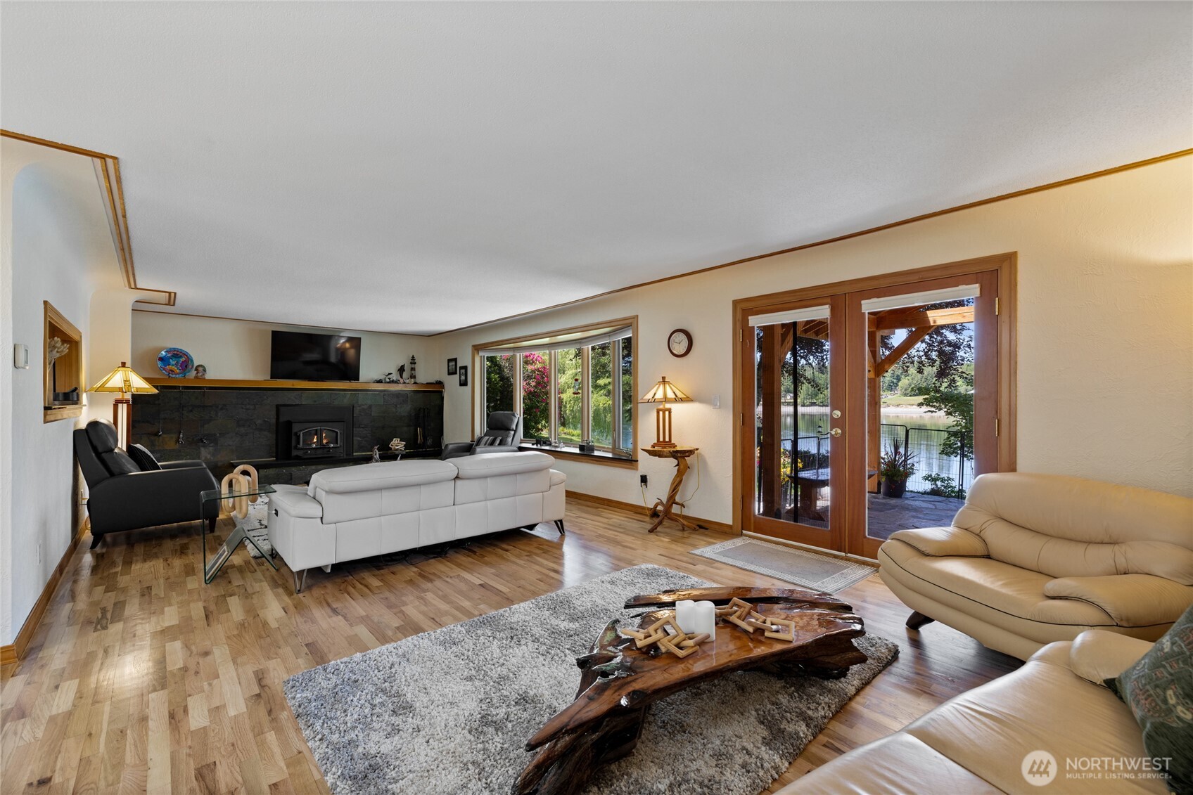 295 Southeast Bayview Road Shelton, WA 98584 - Photo 10 of 40 a living room with furniture and a large window