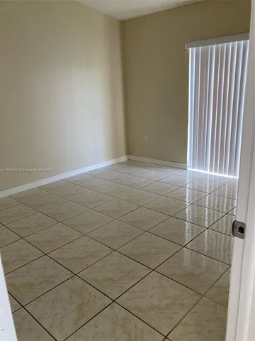 an empty room with a bathroom