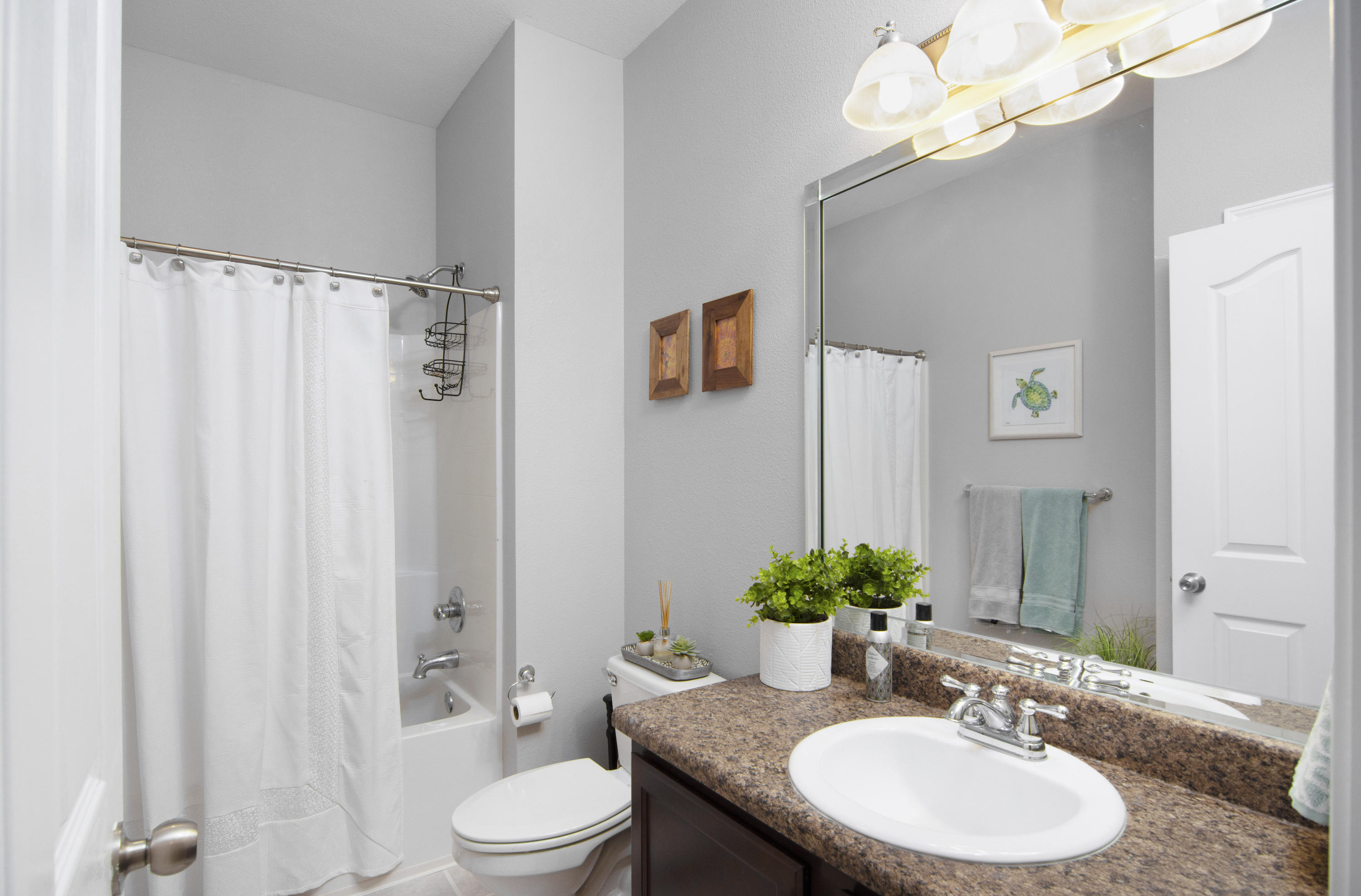 809 Yew Circle Crestview, FL 32536 - Photo 22 of 24 a bathroom with a granite countertop sink toilet a mirror and shower