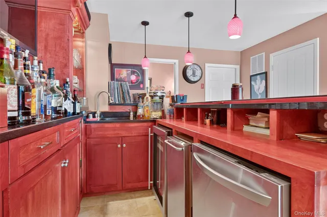 a kitchen with a sink cabinets and window