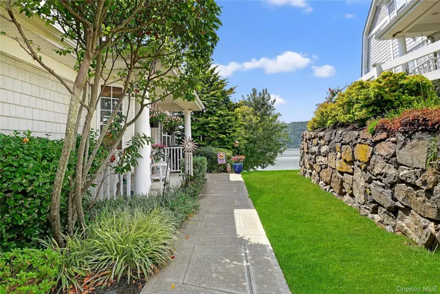 a view of a pathway both side of the house