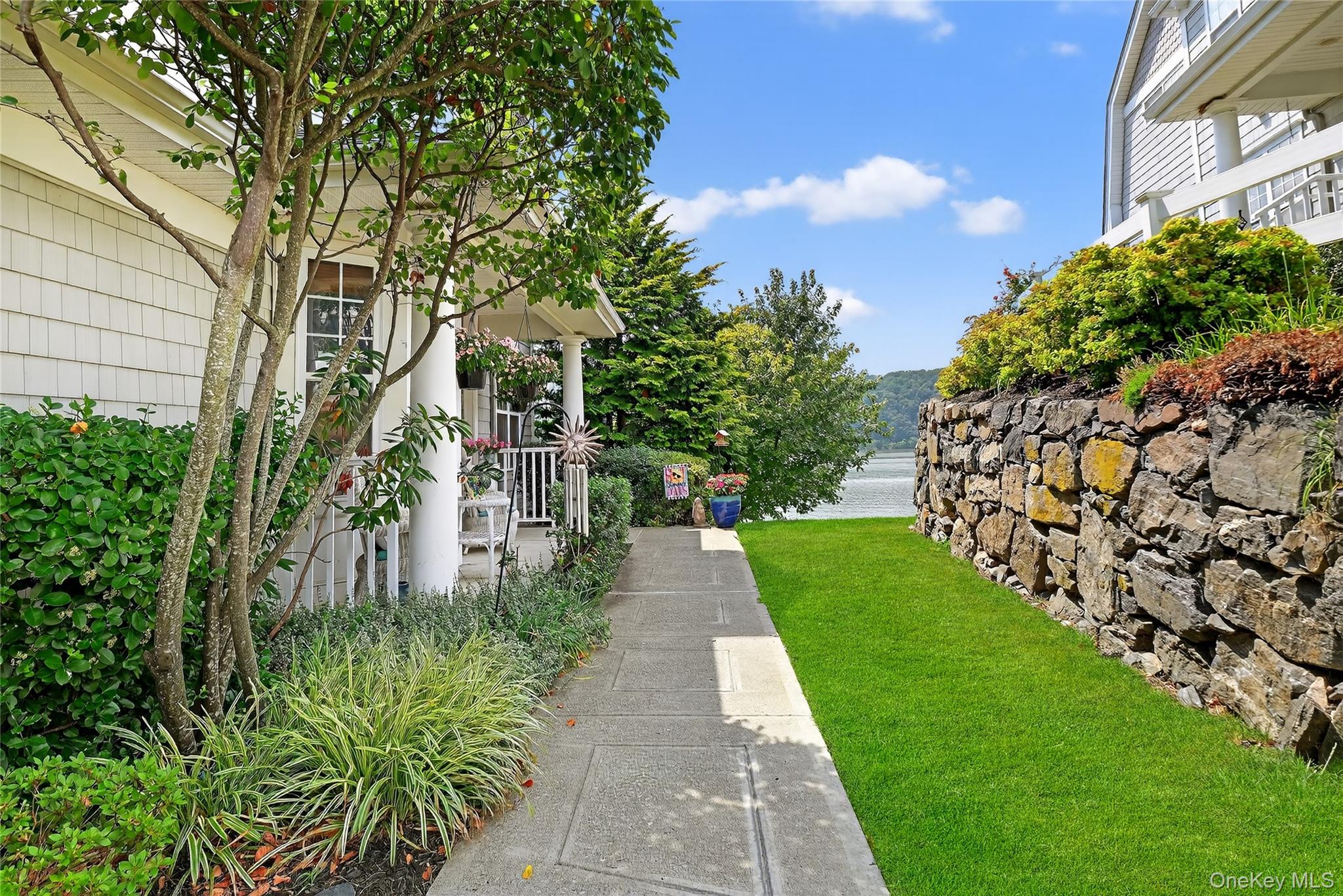 114 Hudson Pointe Drive Poughkeepsie, NY 12601 - Photo 2 of 44 a view of a pathway both side of the house