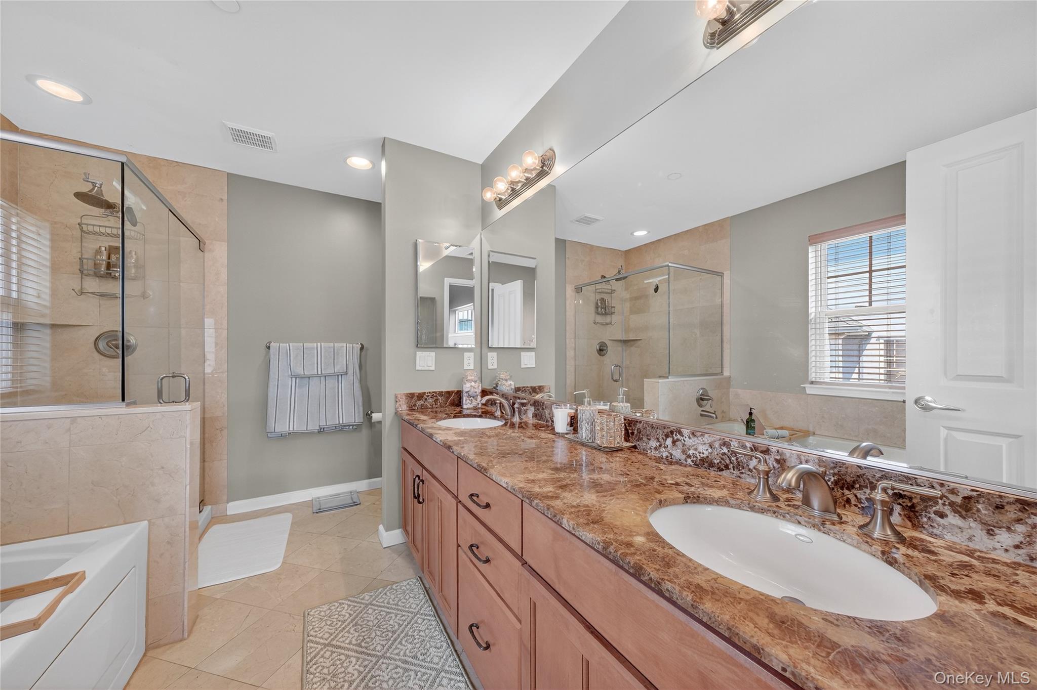 114 Hudson Pointe Drive Poughkeepsie, NY 12601 - Photo 25 of 44 a bathroom with a granite countertop double vanity sink a mirror and a shower