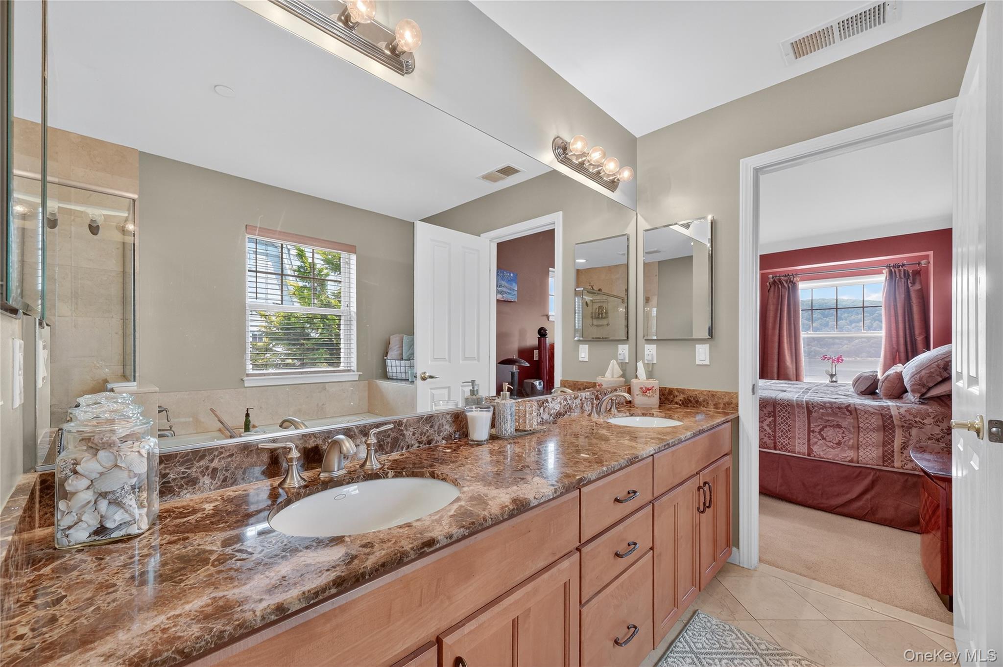 114 Hudson Pointe Drive Poughkeepsie, NY 12601 - Photo 26 of 44 a bathroom with double vanity sinks double vanity tub shower and a mirror