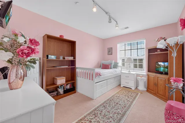 a living room with furniture and flat screen tv