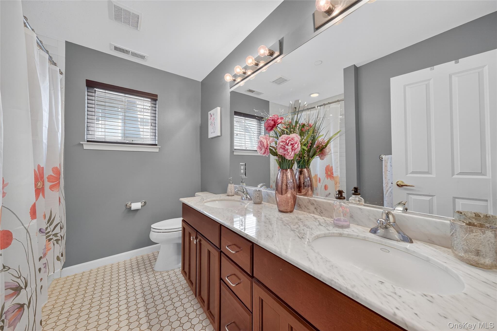 114 Hudson Pointe Drive Poughkeepsie, NY 12601 - Photo 30 of 44 a bathroom with a granite countertop sink a large mirror and a toilet