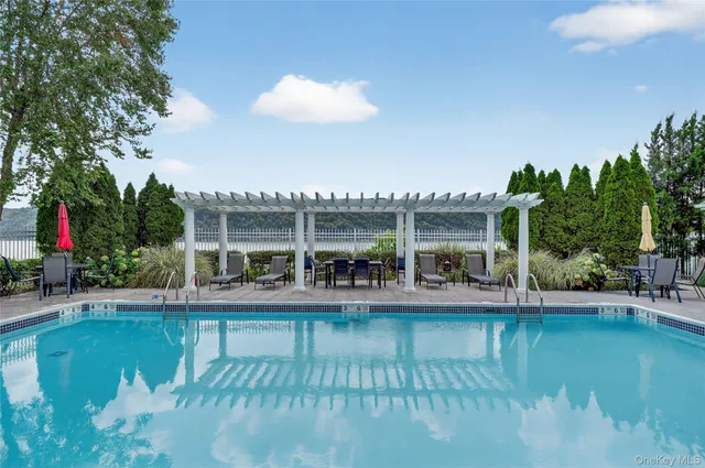 a view of a swimming pool with a patio