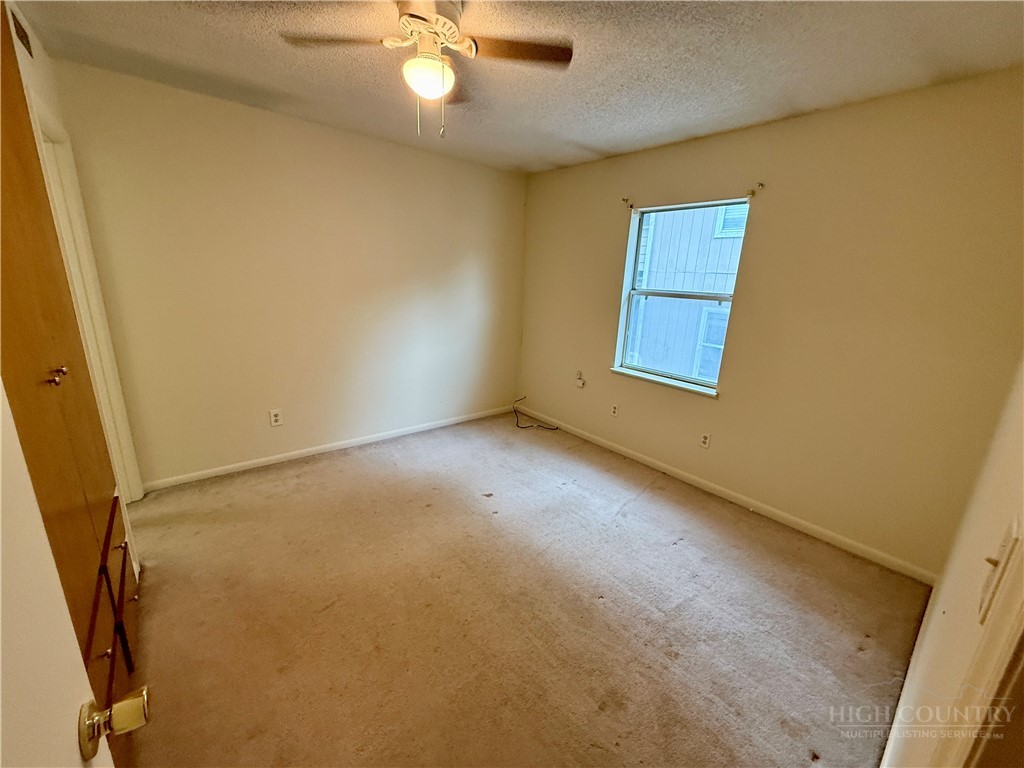 229 East King Street, Unit 30 Boone, NC 28607 - Photo 12 of 19 an empty room with a window