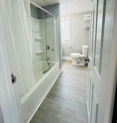 155 Oak Street, Unit 1 Taunton, MA 02780 - Photo 12 of 12 a bathroom with a tub and shower