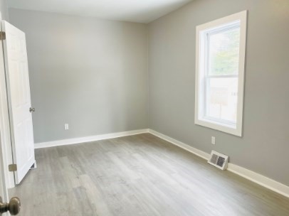 155 Oak Street, Unit 1 Taunton, MA 02780 - Photo 5 of 12 a view of an empty room with a window