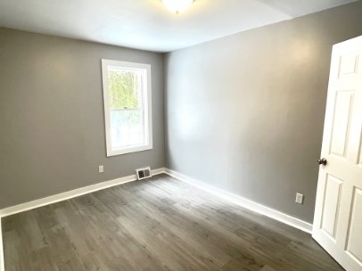 155 Oak Street, Unit 1 Taunton, MA 02780 - Photo 8 of 12 an empty room with windows