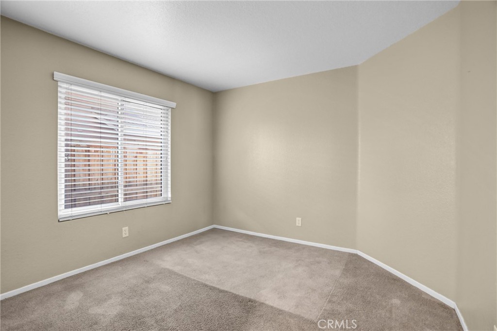 7741 Morningside Lane Highland, CA 92346 - Photo 18 of 24 a view of an empty room with a window