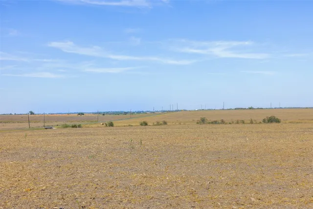 a view of an ocean beach and mountain