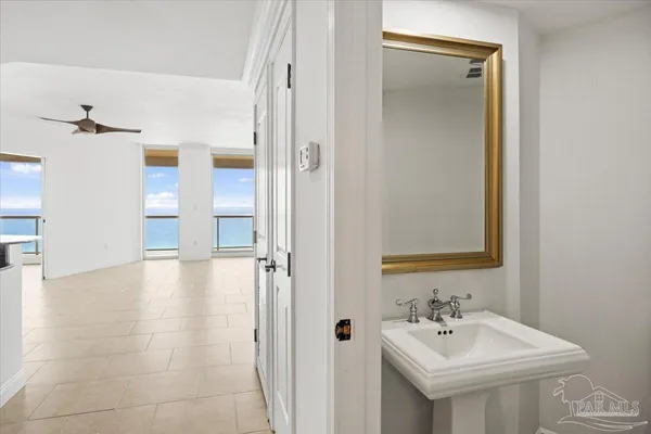 a bedroom with a large bed and a large window
