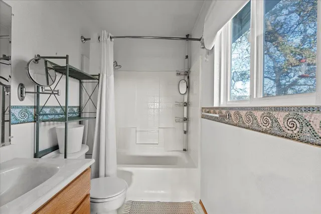 a bedroom with bed and window