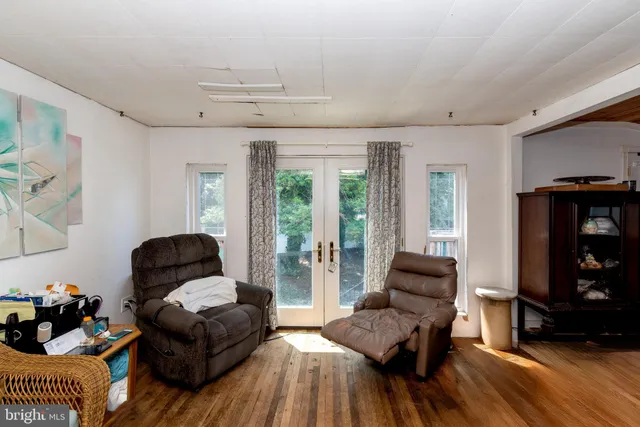 a kitchen with stainless steel appliances a stove a microwave a sink and cabinets